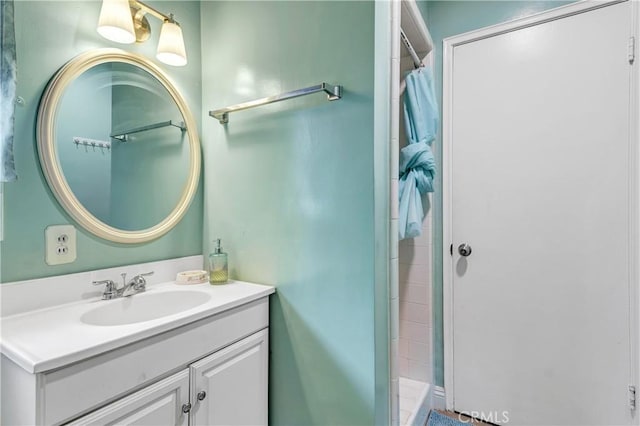 bathroom with vanity and a shower with shower curtain