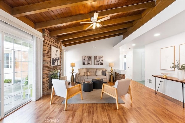 living room with a healthy amount of sunlight, ceiling fan, and light wood-type flooring