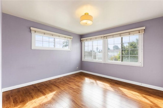 spare room featuring hardwood / wood-style flooring