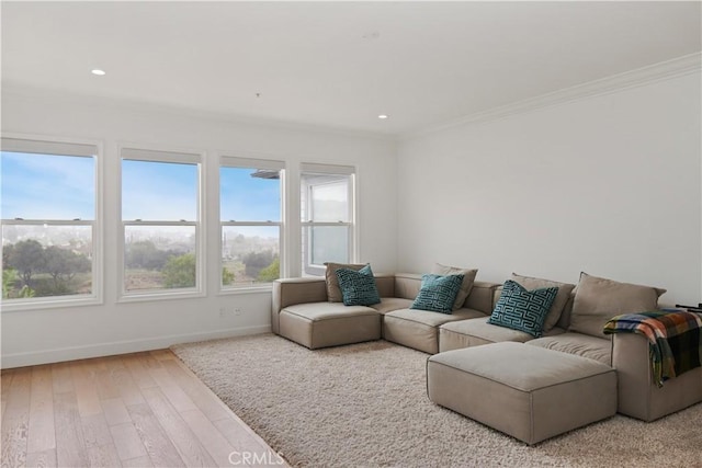 living area featuring recessed lighting, crown molding, baseboards, and wood finished floors