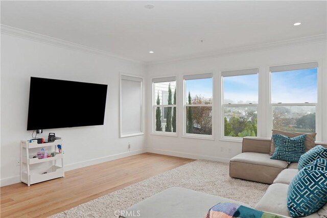 living room with crown molding, recessed lighting, wood finished floors, and baseboards