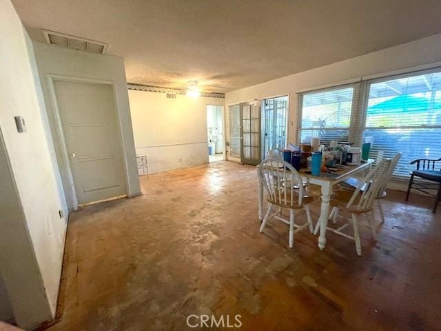 dining room with concrete floors