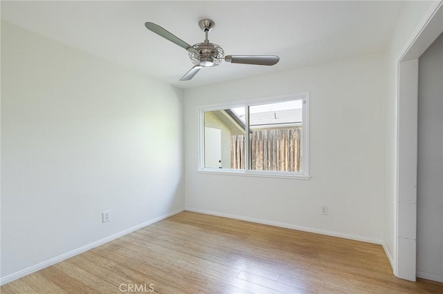 unfurnished room featuring light hardwood / wood-style flooring and ceiling fan