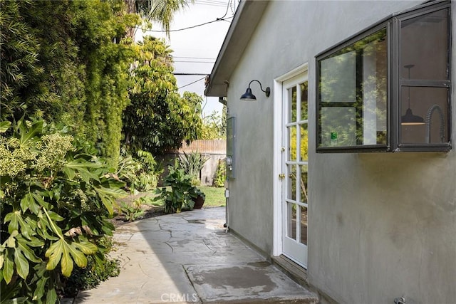 view of side of property with a patio area