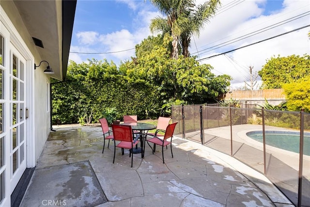 view of patio / terrace featuring a fenced in pool