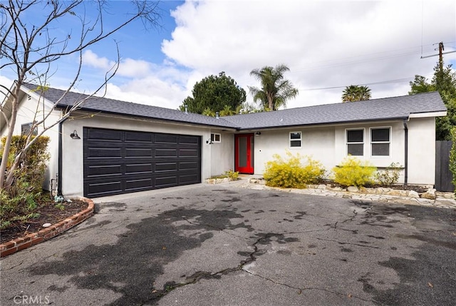 ranch-style house featuring a garage