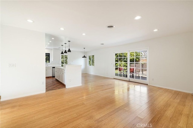 unfurnished living room featuring light hardwood / wood-style floors