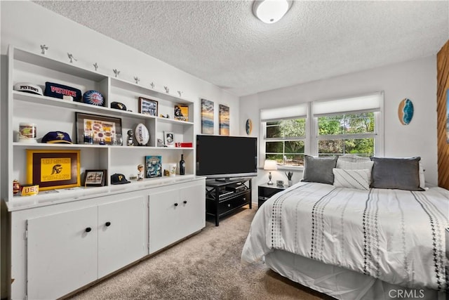 carpeted bedroom featuring a textured ceiling