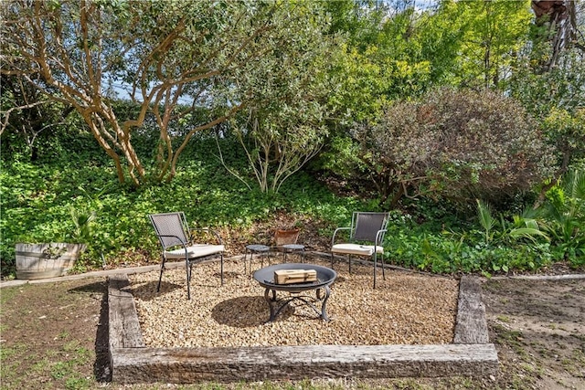 view of yard with a fire pit