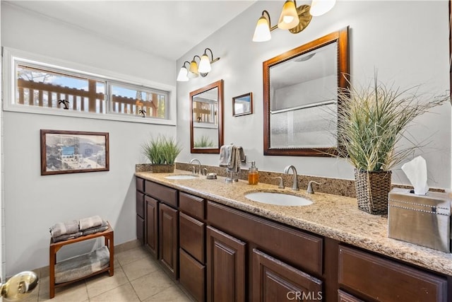 bathroom with vanity and tile patterned flooring