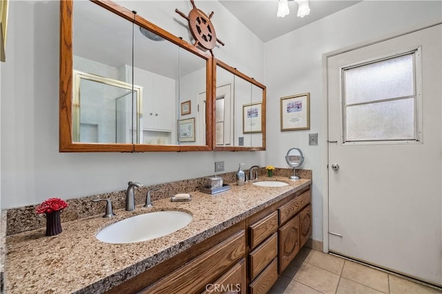 bathroom featuring walk in shower, tile patterned floors, and vanity