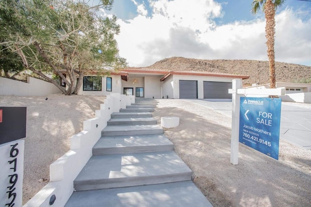 view of front of home with a garage