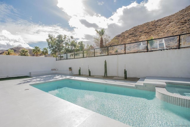 view of pool with a mountain view