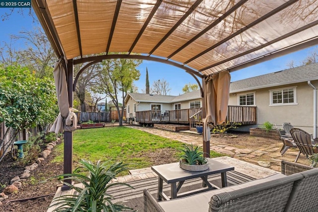 view of patio / terrace featuring a wooden deck and a pergola