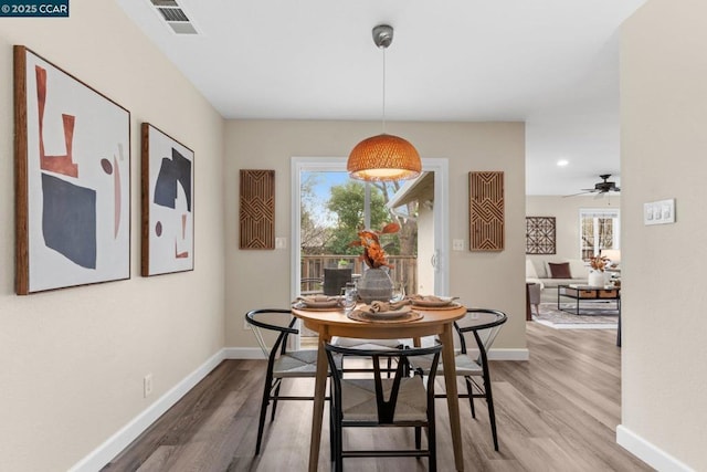 dining area featuring hardwood / wood-style floors