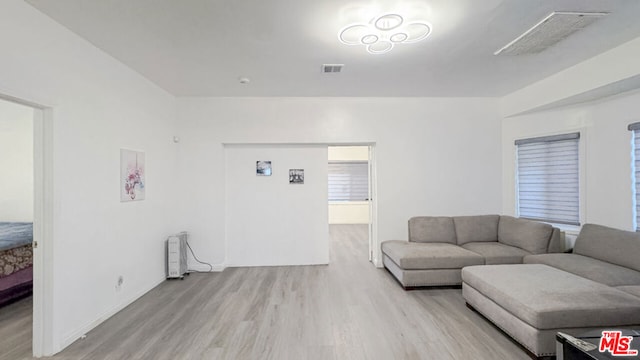 living room with light hardwood / wood-style flooring