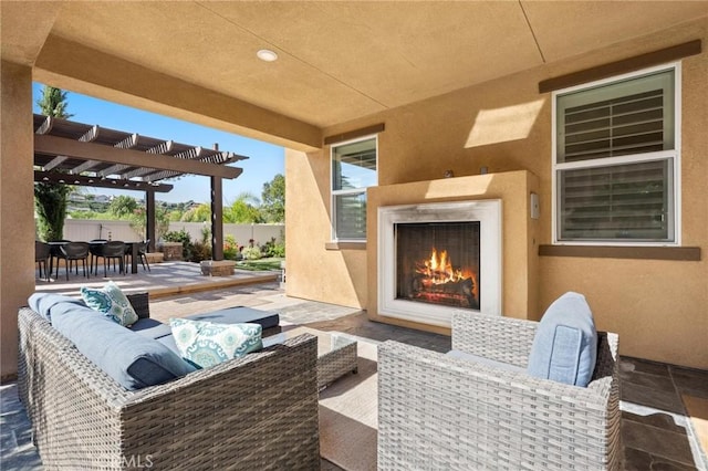 view of patio with a pergola and an outdoor living space with a fireplace