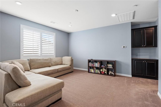 living room with light colored carpet