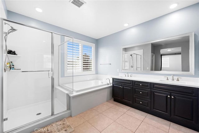 bathroom featuring tile patterned flooring, vanity, and independent shower and bath