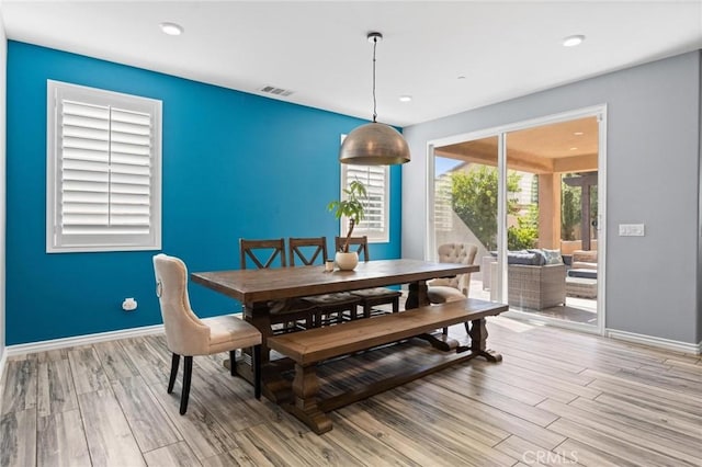 dining area with hardwood / wood-style flooring