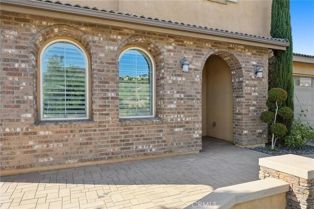 property entrance with a garage