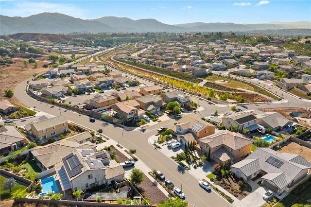 birds eye view of property with a mountain view