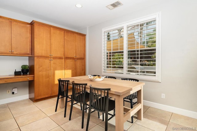 tiled dining area with built in desk