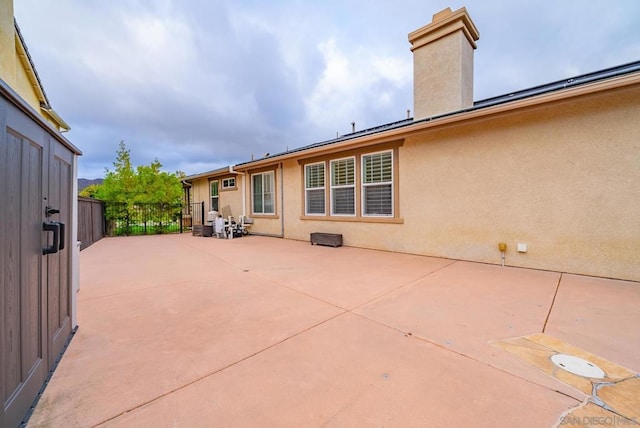 back of property with a patio area