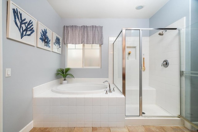 bathroom with independent shower and bath and tile patterned flooring