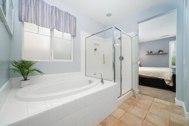 bathroom with tile patterned floors and plus walk in shower