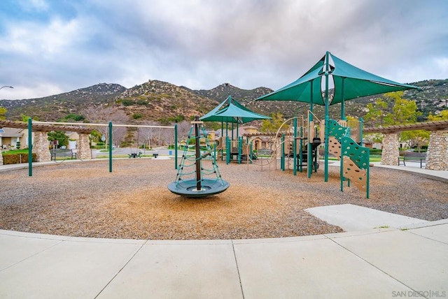 view of playground featuring a mountain view