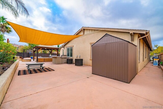 exterior space with a gazebo and central AC