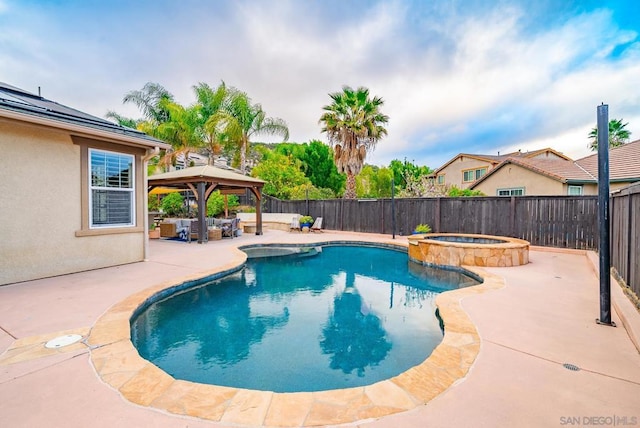 view of swimming pool with a gazebo, an outdoor living space, an in ground hot tub, and a patio area