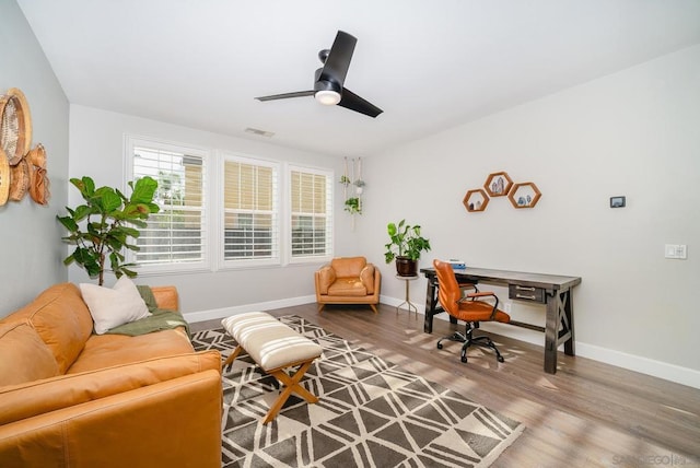 office space with hardwood / wood-style flooring and ceiling fan