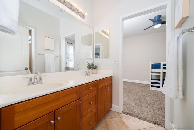 bathroom with tile patterned flooring, vanity, and ceiling fan