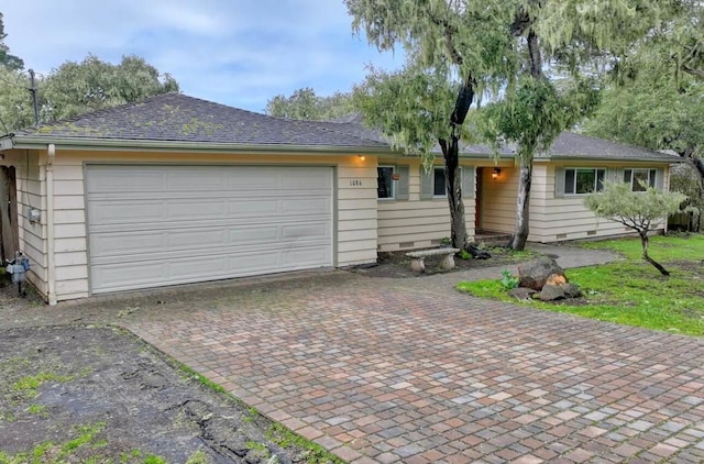 ranch-style home with a garage