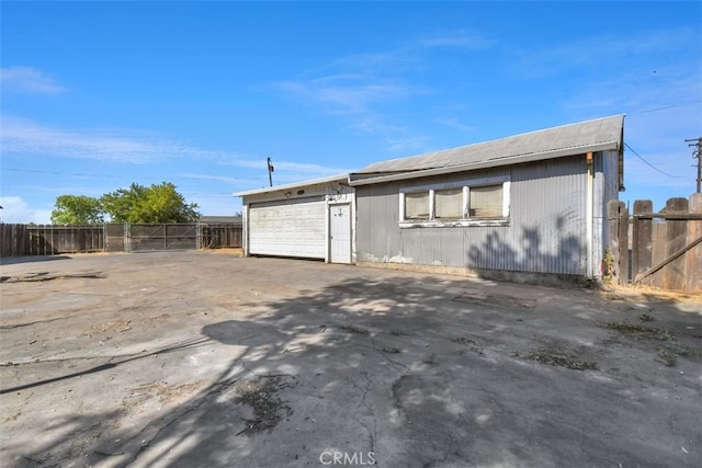 view of side of property featuring a garage