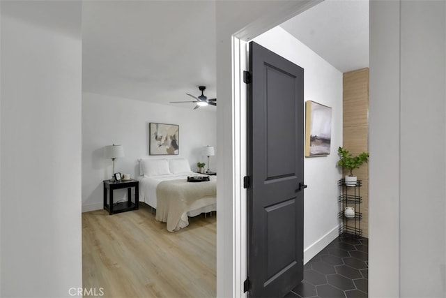 bedroom featuring hardwood / wood-style floors and ceiling fan