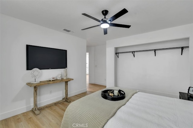 bedroom featuring hardwood / wood-style flooring and ceiling fan