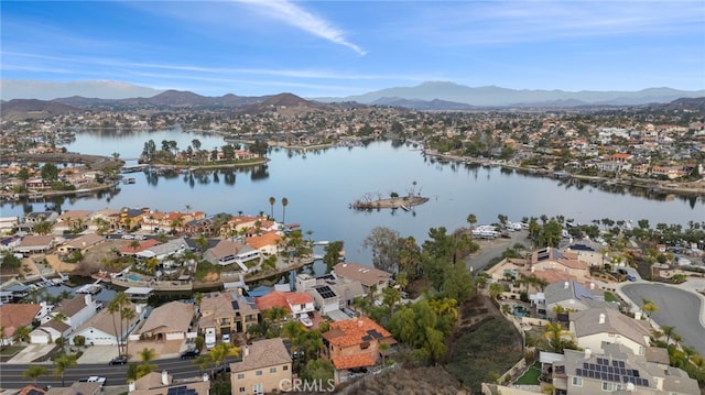 bird's eye view featuring a water and mountain view