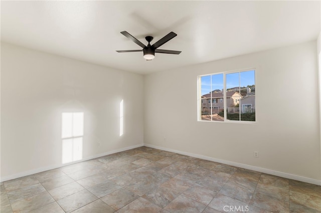 empty room featuring ceiling fan