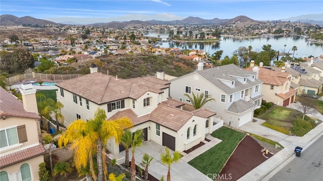 bird's eye view featuring a water and mountain view