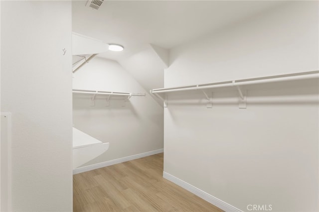 walk in closet featuring light wood-type flooring