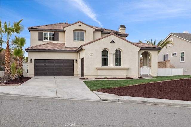 mediterranean / spanish-style house featuring a garage