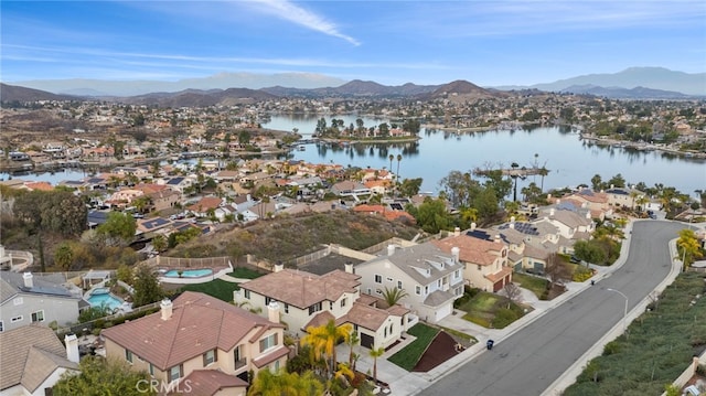 bird's eye view with a water and mountain view