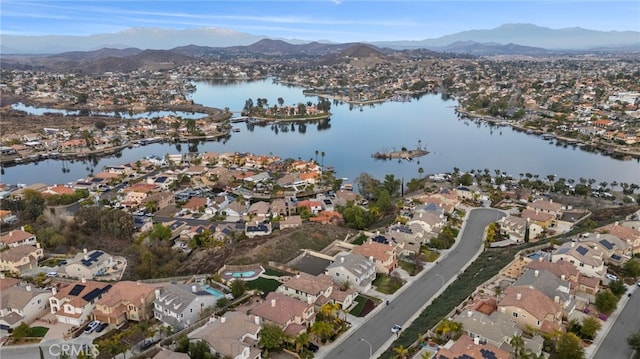 drone / aerial view with a water and mountain view