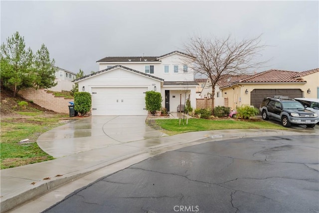 view of front facade with a garage and a front lawn