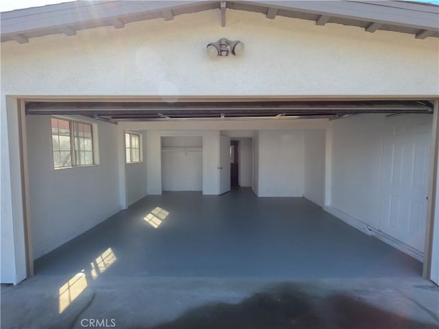 garage featuring a carport