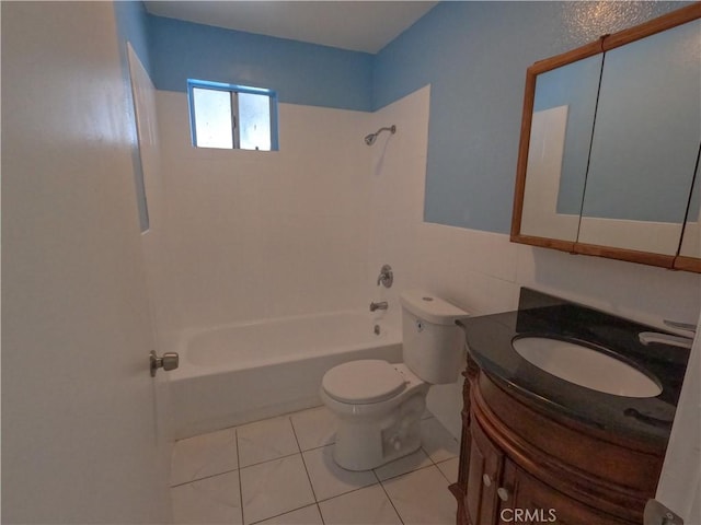 full bathroom featuring vanity, tile patterned flooring, toilet, and tiled shower / bath