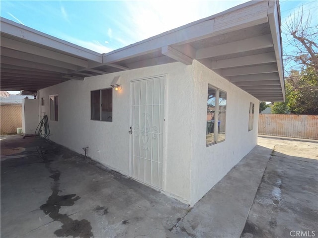 view of side of property featuring a patio